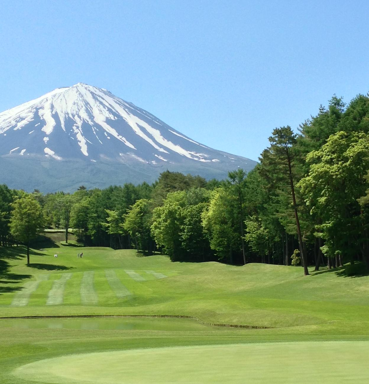 Golf course framed by Mount Fuji